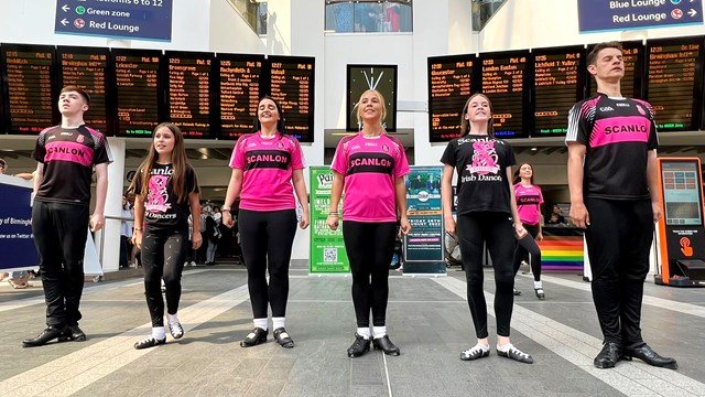 Irish dancers perform at Birmingham New Street station during the Commonwealth Games