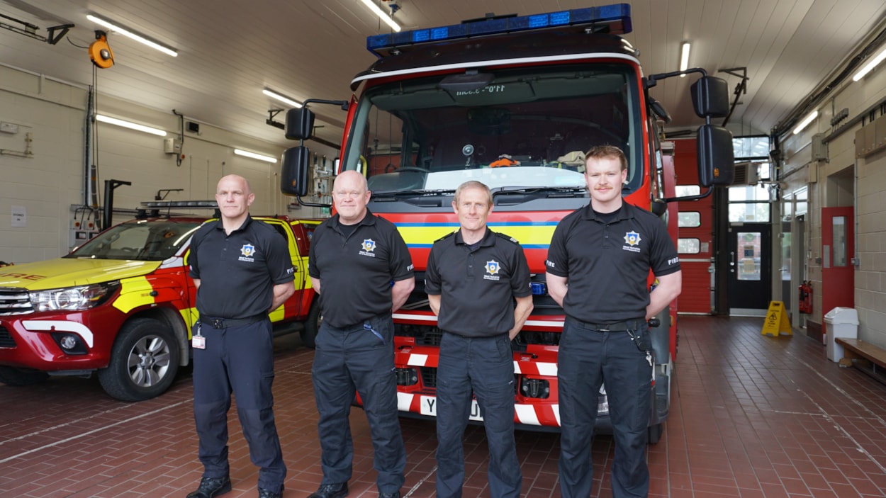 West Yorkshire Fire and Rescue Service staff with one of their service vehicles: West Yorkshire Fire and Rescue Service staff with one of their service vehicles