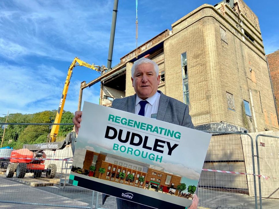 Cllr Patrick Harley in front of the partially demolished Hippodrome