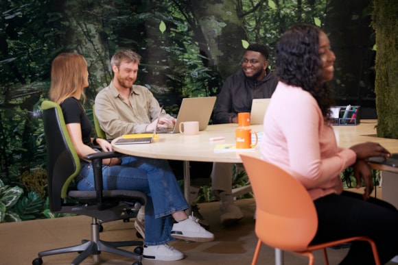 Happy colleagues at desk