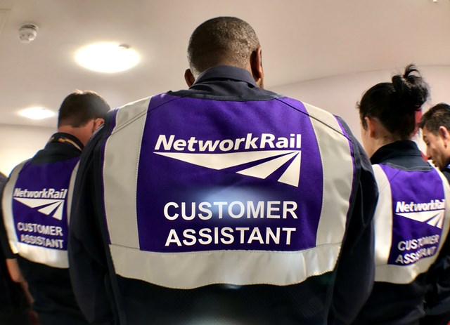 Backs of the new purple uniforms worn by Customer Assistant staff