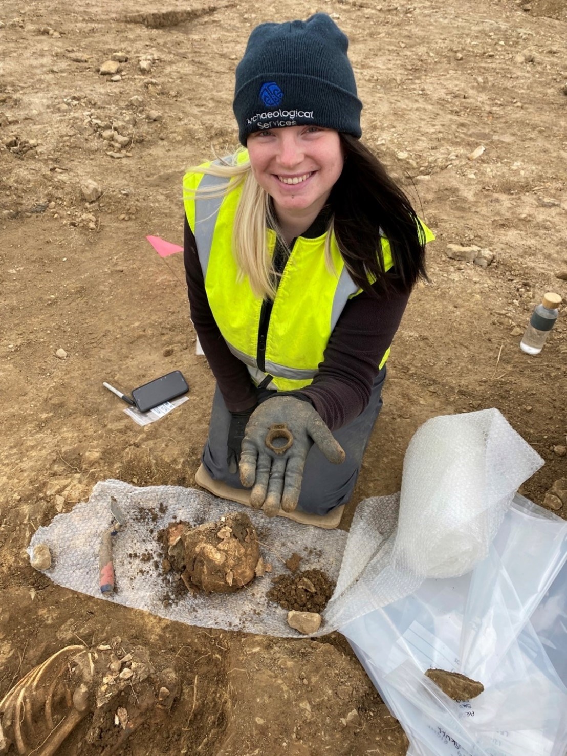 Garforth dig: Archaeologist Chloe Scot excavating one of the graves at the site where an ancient lead coffin has been unearthed in a previously-undiscovered, 1,600-year-old Leeds cemetery.
The once-in-a-lifetime find, thought to contain the remains of a late-Roman aristocratic woman, was discovered as part of an archaeological dig near Garforth in Leeds, which also revealed the remains of more than 60 men, women and children who lived in the area more than a thousand years ago.