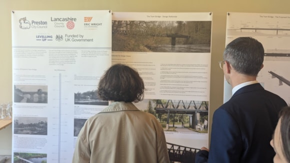 Cllr Phillippa Williamson and Cllr Aidy Riggott looking at the plans in the Pavilion Cafe