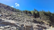 A 40m long anchored catch fence will reduce the rock fall risk to track and road users.: A 40m long anchored catch fence will reduce the rock fall risk to track and road users.