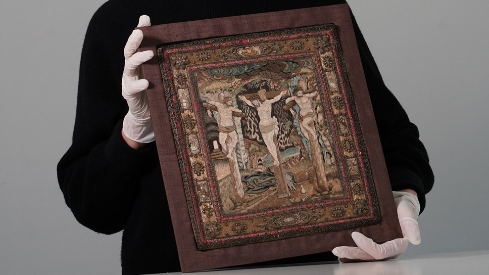 Helen Wyld, Senior Curator of Historic Textiles at National Museums Scotland, with the 17th century embroidery. Photo © Stewart Attwood WEB