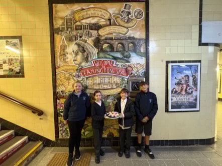 School pupils with Railway 200 cakes by the murals 2-2