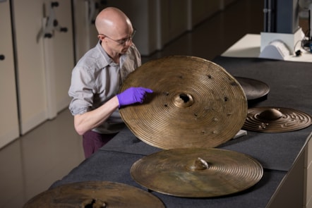 National Museums Scotland curator Dr Matthew Knight with the Bronze Age shields. Photo © Duncan McGlynn (7)