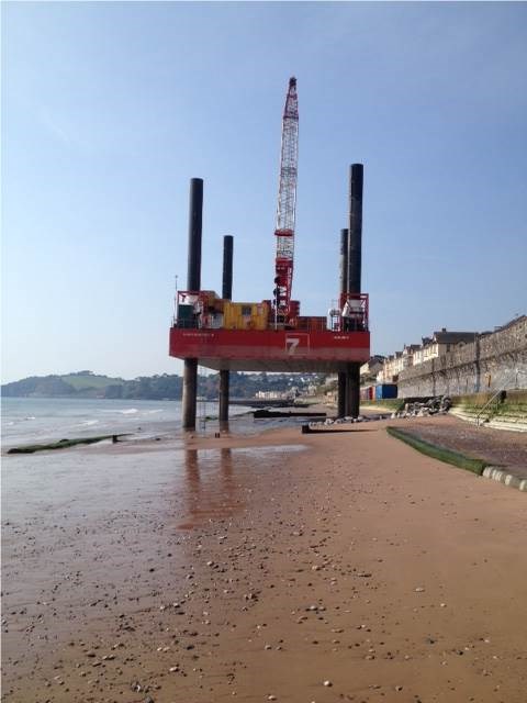 Barge at Dawlish: Barge at Dawlish to complete improvement works on the last section of walkway between Rockstone and Coast Guard footbridges.