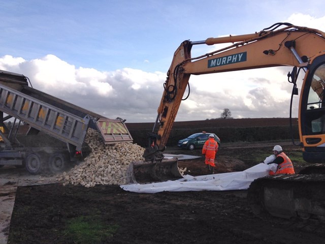 Amended timetable for train passengers as Leighton Buzzard bank slip is repaired: Leighton Buzzard, lorry load of railway foundation stone delivered to site