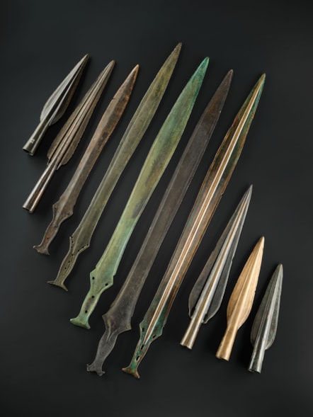 Bronze Age spearheads and swords from Scotland. Image © National Museums Scotland