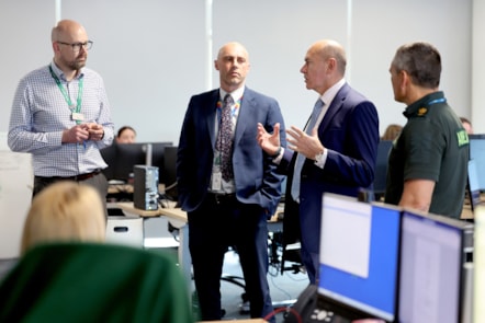 Sir Jim Mackey speaks to deputy chief operations officer Chris Dawson, chief executive Kev Scollay and head of emergency preparedness, resilience and response Stu Holliday
