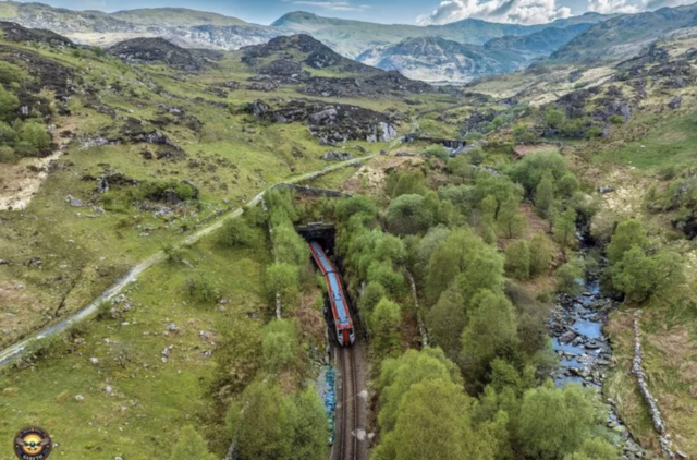 A train exits the northern end of the Ffestiniog Tunnel on the Conwy Valley Line (credit Welsh Skies by Gareth): A train exits the northern end of the Ffestiniog Tunnel on the Conwy Valley Line (credit Welsh Skies by Gareth)