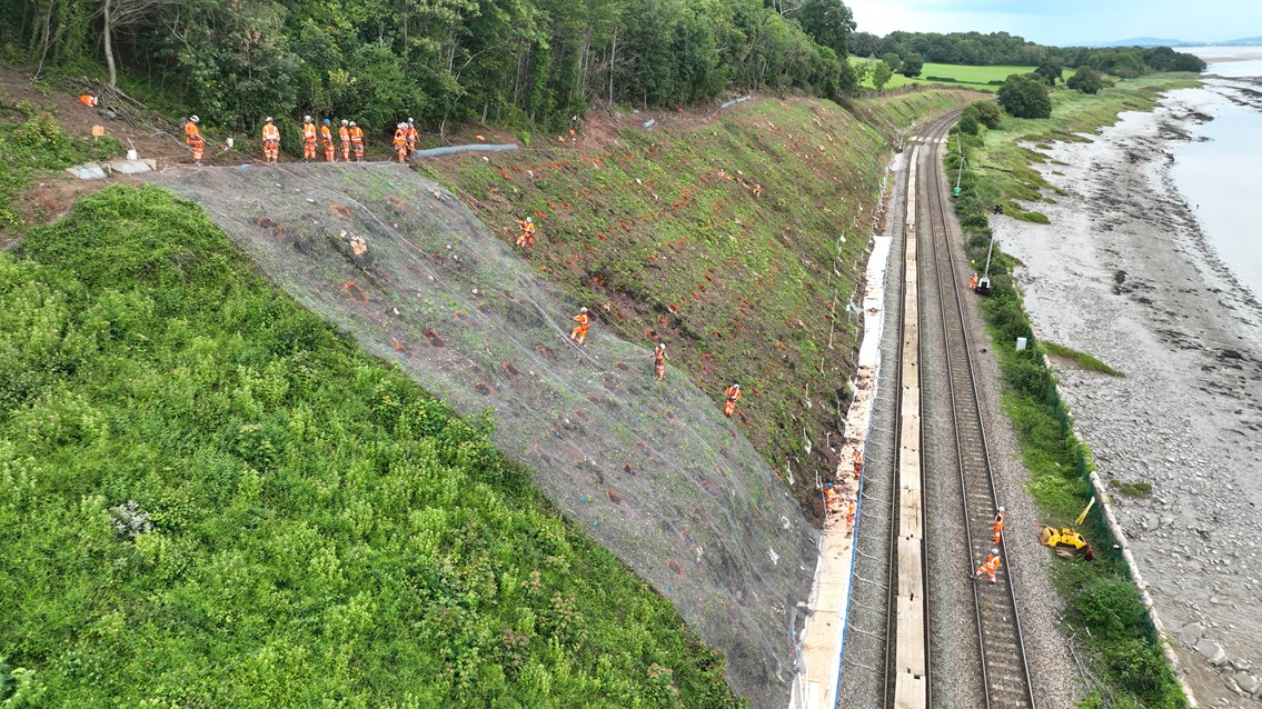 Wide shot of rope access team down face SERP 2023