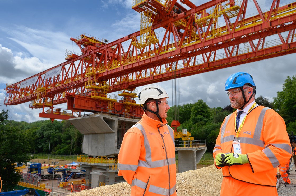 Construction starts on the Colne Valley Viaduct with the launch of a giant bridge building machine-2: Construction has started on the Colne Valley Viaduct as a 160m long bridge building machine begins construction. 

It will install 1,000 individual segments – each one unique and ranging from 60 to 140 tonnes. All will be 4m wide, up to 4m long and up to 6.7m high.

Tags: Construction, Colne Valley Viaduct, Bridge. Engineering

People (L-R): Tom O'Connor, HS2 Project Engineer; Andrew Stephenson MP, HS2 Minister