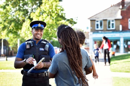 A police officer talking to a member of the public