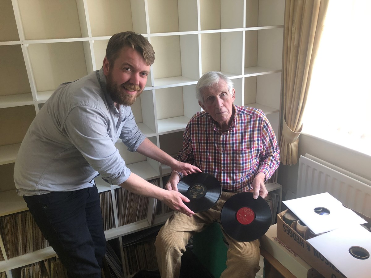 William Dean-Myatt (right) hands over the remaining shellac discs to the Library's Sound Collections Curator, Alistair Bell.