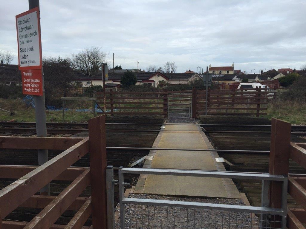 Children warned of the dangers of playing on the railway following near miss at Welsh level crossing: Sandy Lane level crossing