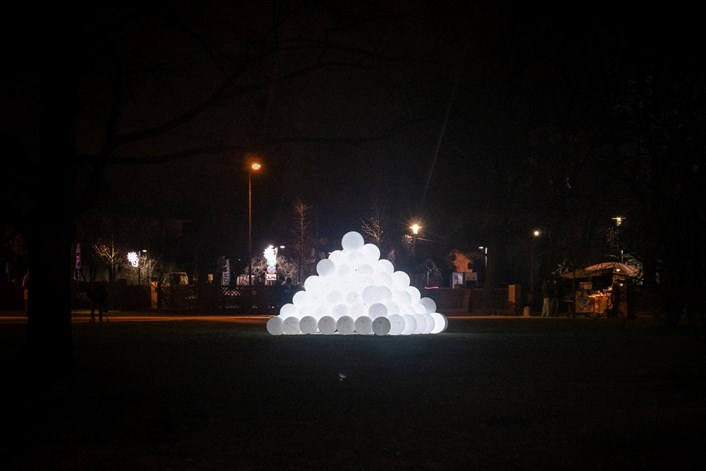 Baloomi: Baloomi, by Polish artist Artur Grycuk. This installation consists of balloons filled with air and white light that creates a glowing pyramid with simple light sequences.