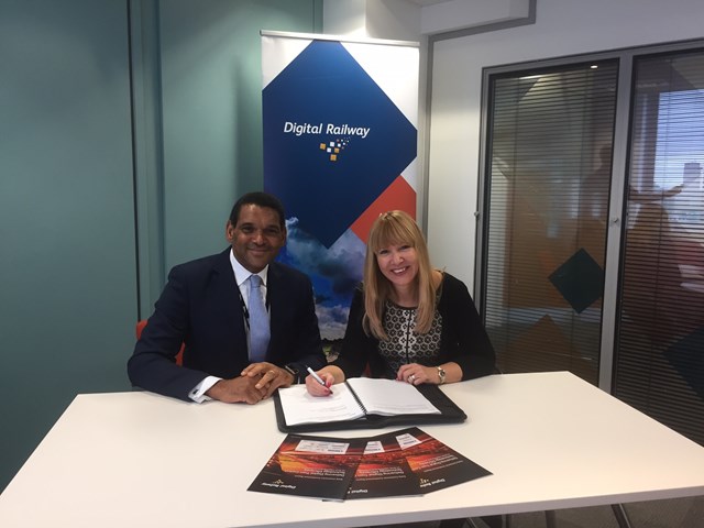 David Waboso, group managing director for Digital Railway and Anna Ince, chief executive officer at Resonate signing the two year contract