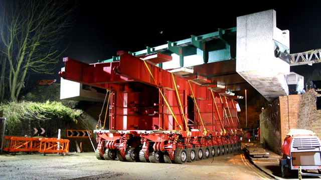 Self-propelled modular transporter (SPMT) carrying a bridge similar to the one which will be installed in Leamington Spa
