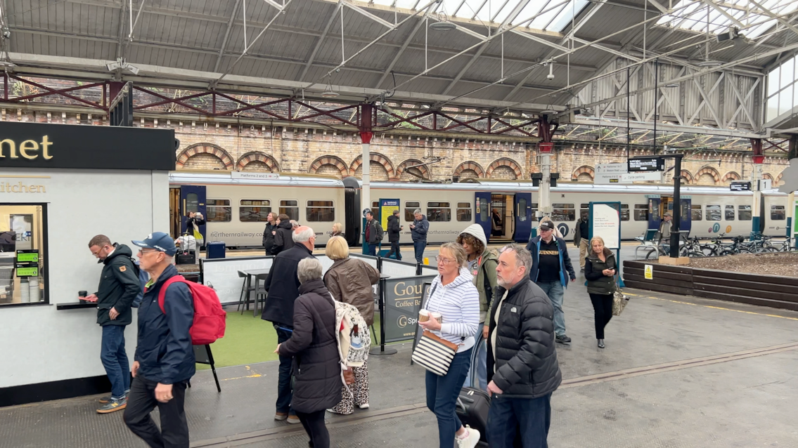 Passengers walking through Crewe Sation October 2026