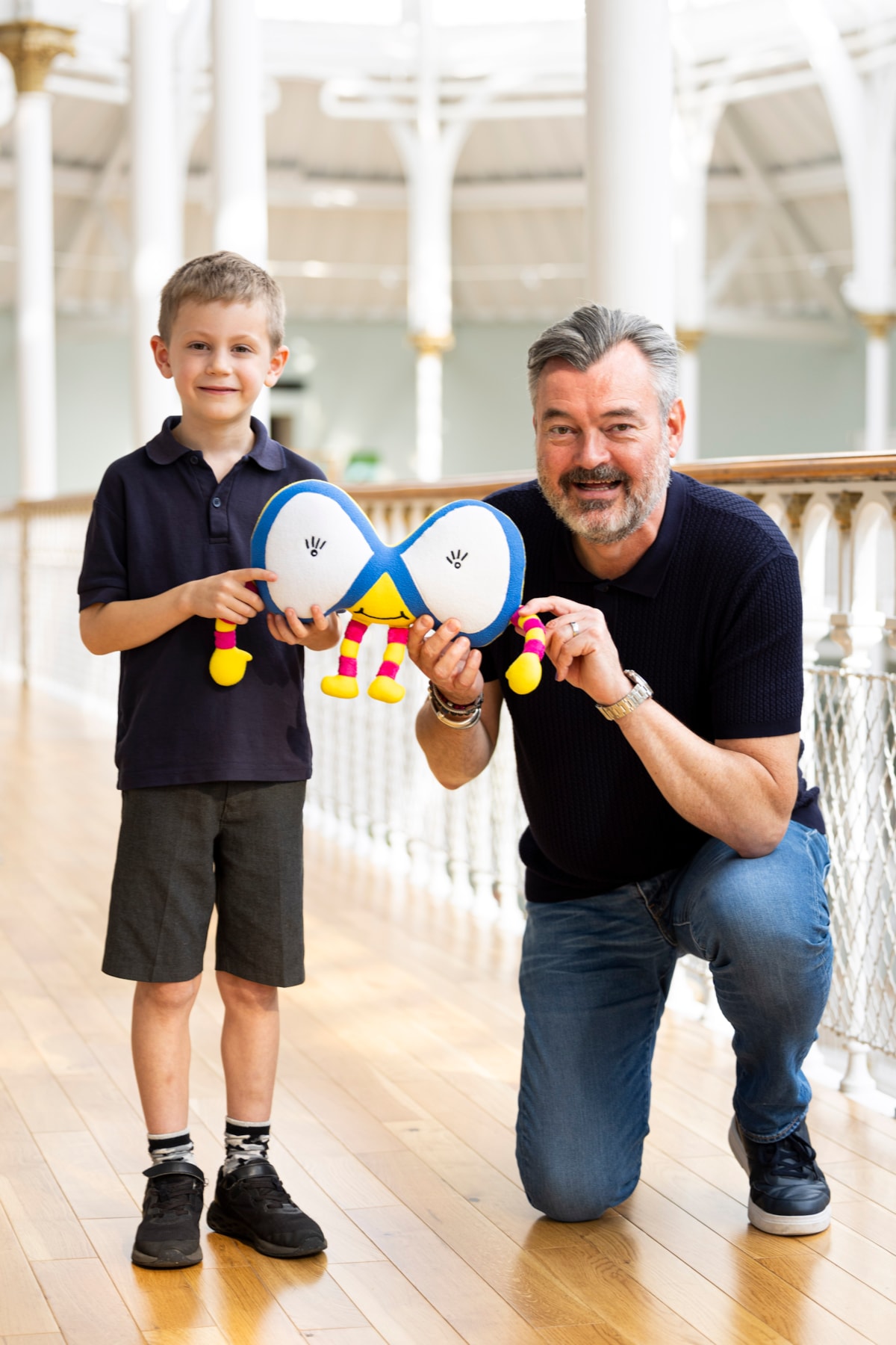 Grant Stott presents 7-year-old William Lunsden with his winning Mathscot design at the National Museum of Scotland. Photo (c) Duncan McGlynn (3)