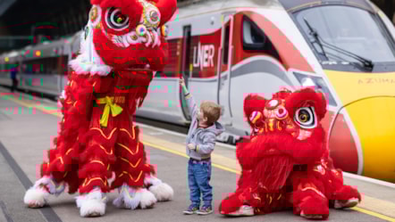 LNER Lions at King's Cross with young customer ahead of Chinese New Year
