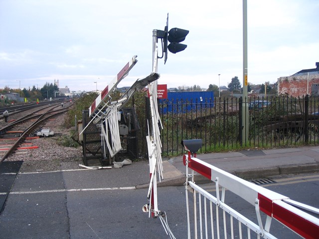 Barriers severely damaged after a road/rail collision in Gloucester.