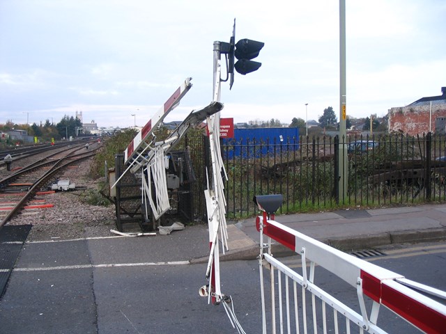 Barriers severely damaged after a road/rail collision in Gloucester.: DRTR