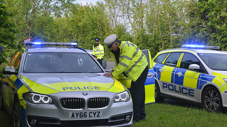 Police officers and cars - Hero Image