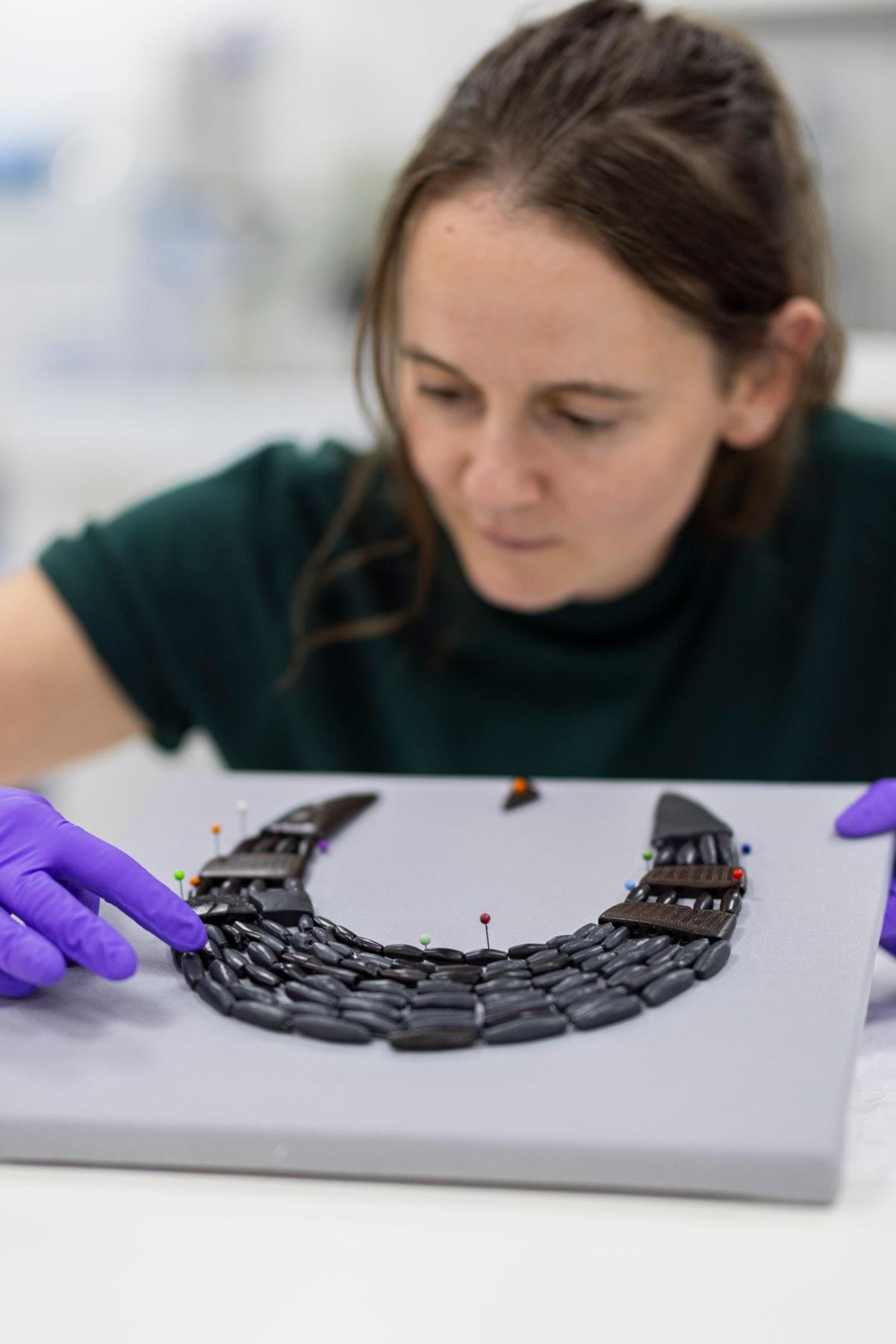 Conservator Bethan Bryan works on the Balgay necklace.  Photo © Duncan McGlynn-7