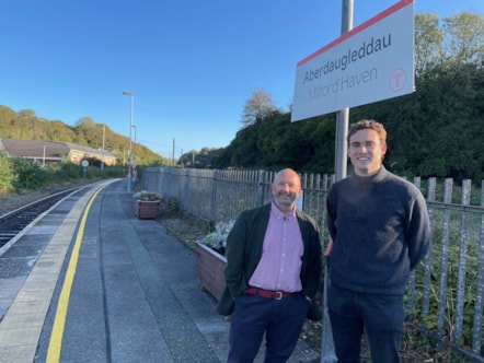 Cabinet Member for Residents' Services Cllr Rhys Sinnett at Milford Haven train station with Pembrokeshire MP Henry Tufnell