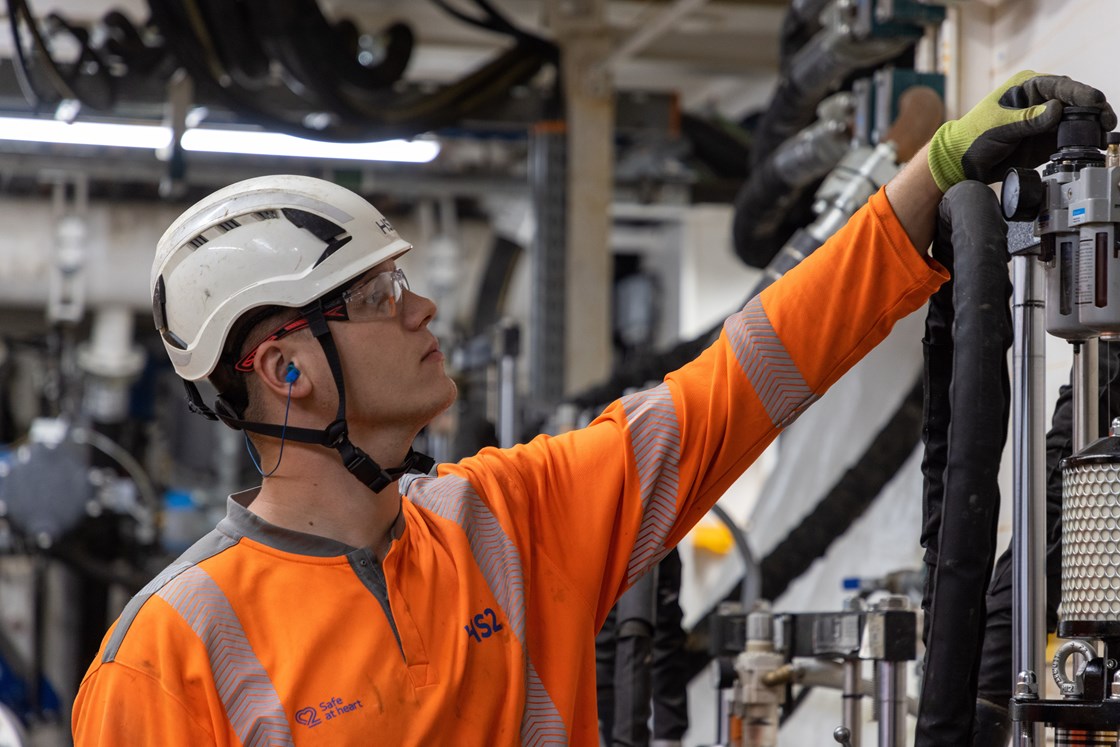 Tunnelling Engineer checking pressure onboard HS2 tunnel boring machine Cecilia, August 2021 HS2-VL-28601