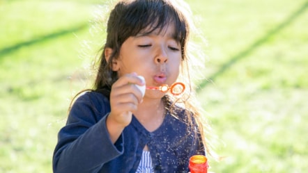 Girl blowing bubbles