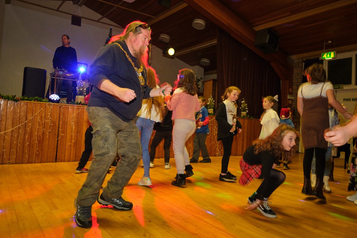 Provost Jim Todd dancing with children