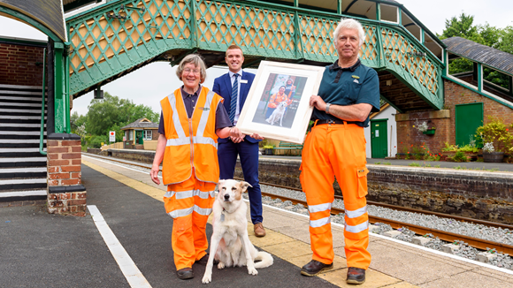 Tom and Sue Baxter with beloved dog Rosie and Christian Irwin of Network Rail