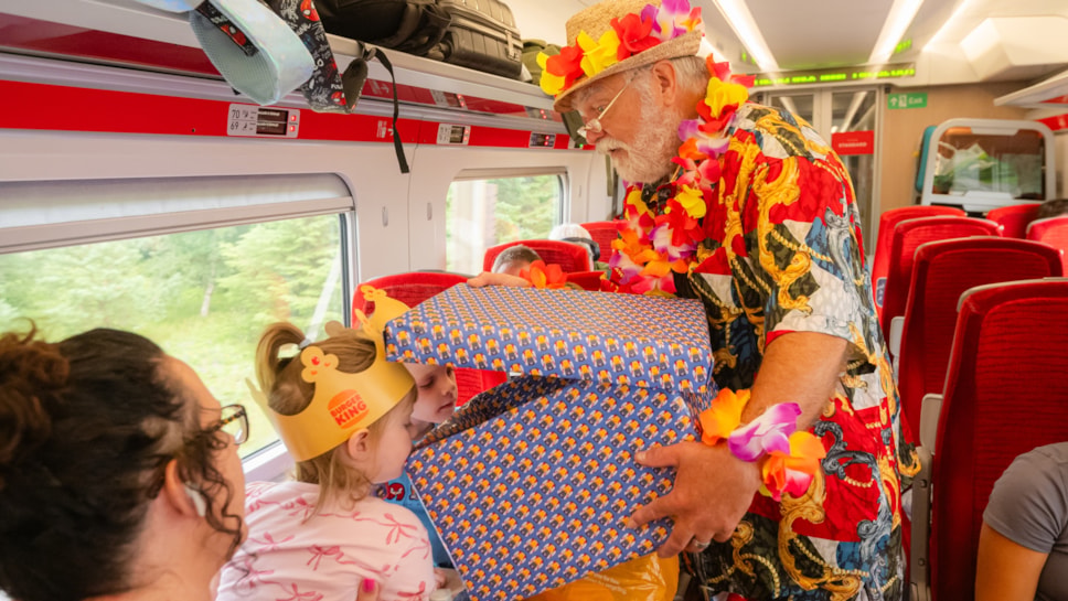 'Summer Santa' surprises young customers with Christmas presents on LNER train