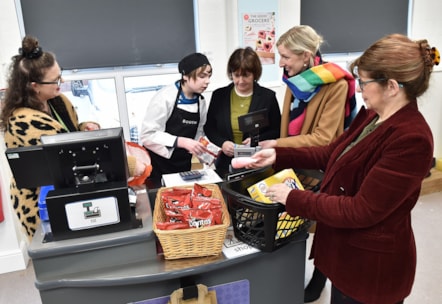 Lancashire County Councillors Phillippa Williamson (centre) and Jayne Rear (right), pictured with Bleasdale School pupil Sebastian (second from left) at the pop up shop, along with staff from Booths supermarket.