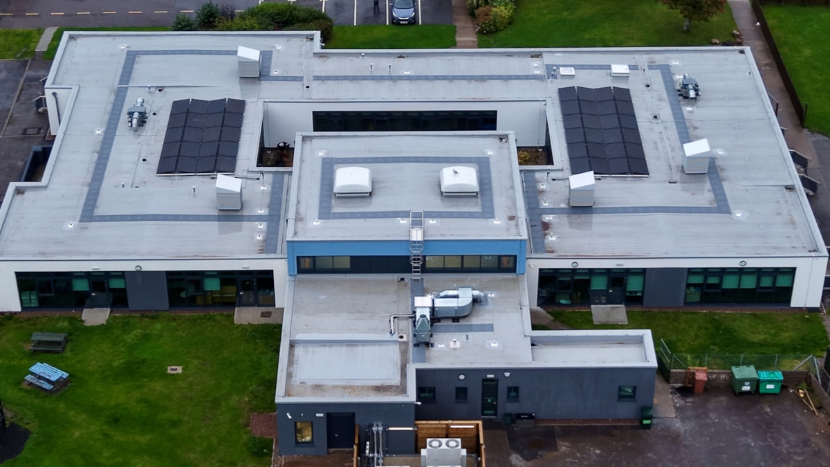 Aerial view of Cullen Primary School following refurbishment, showing the upgraded roof, solar panels and external building improvements.