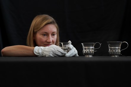 Curator Lyndsay McGill with a selection of thistle cups © Stewart Attwood