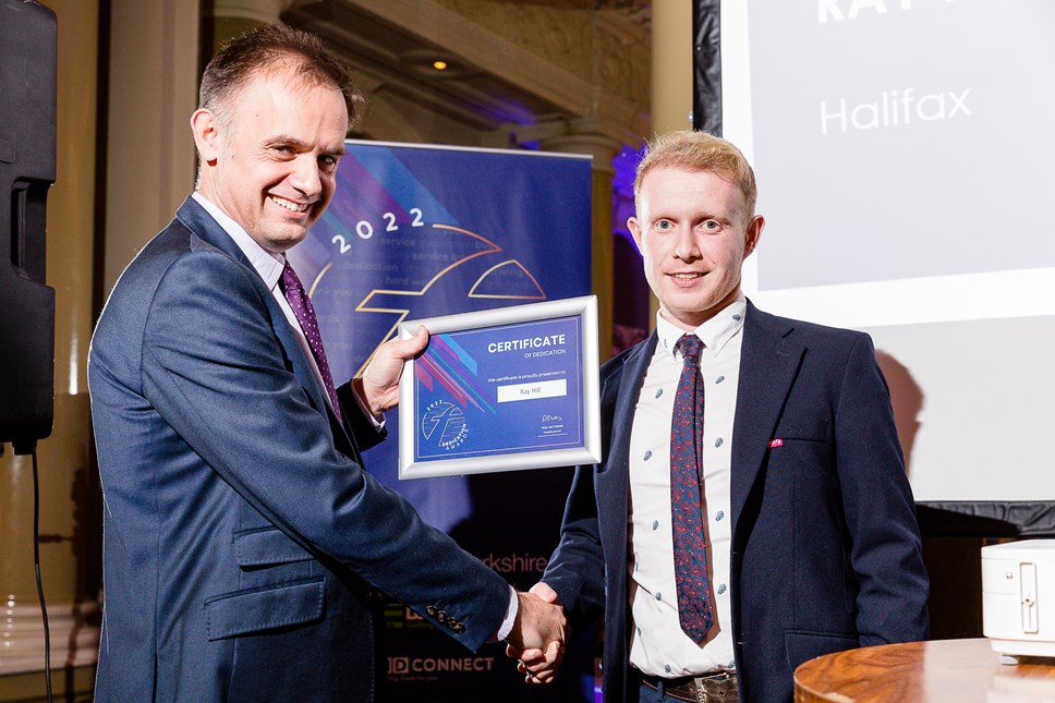 Ray Hill (right) receives his award from Tom Bridge, Operations Director of First West Yorkshire