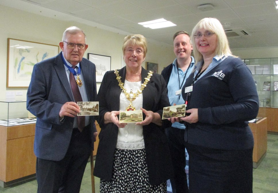 Mayor and consort present postcards to archives staff  Jane Humphrey and Mike Bevan