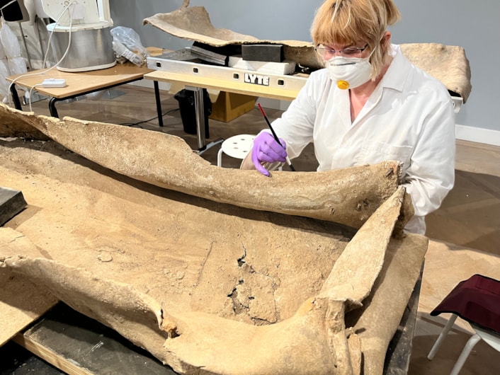 Living with Death coffin display: Emma Bowron, conservator with Leeds Museums and Galleries, works on the ancient lead coffin which lay buried in a Leeds field for more than 1,600 years.
The astonishing discovery, described by experts as a once-in-a-lifetime find, was made during excavation work by West Yorkshire Archaeological Services in a previously unknown site near Garforth.
It will go on display at Leeds City Museum in May as part of a new exhibition called Living with Death.