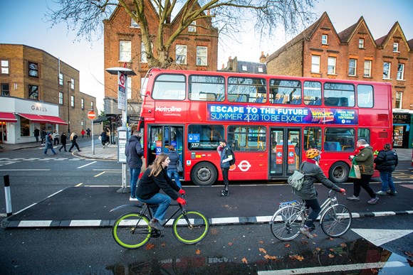 TfL Press Release- Outer London sees 22 per cent rise in cycling as new TfL data further highlights vital role of active travel during the pandemic: TfL image - 'People cycling on a new route in Chiswick'.