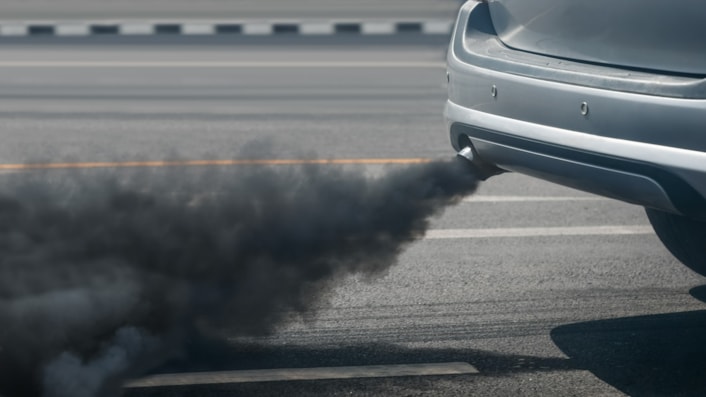 Car exhaust stock. Credit: Adobe Stock: Image shows a close up of a car's exhaust emitting black fumes.