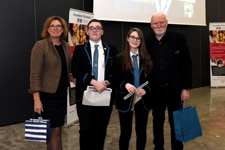 Last year's winners, Doon Academy, present gifts to Sir Tom and Sherry Coutu