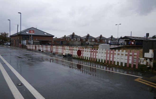 The existing barriers at West Dyke Road level crossing