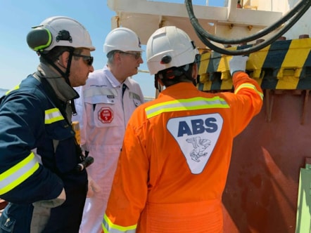 ABS Chairman, President and CEO, Christopher J. Wiernicki on board a vessel with ABS surveyors.