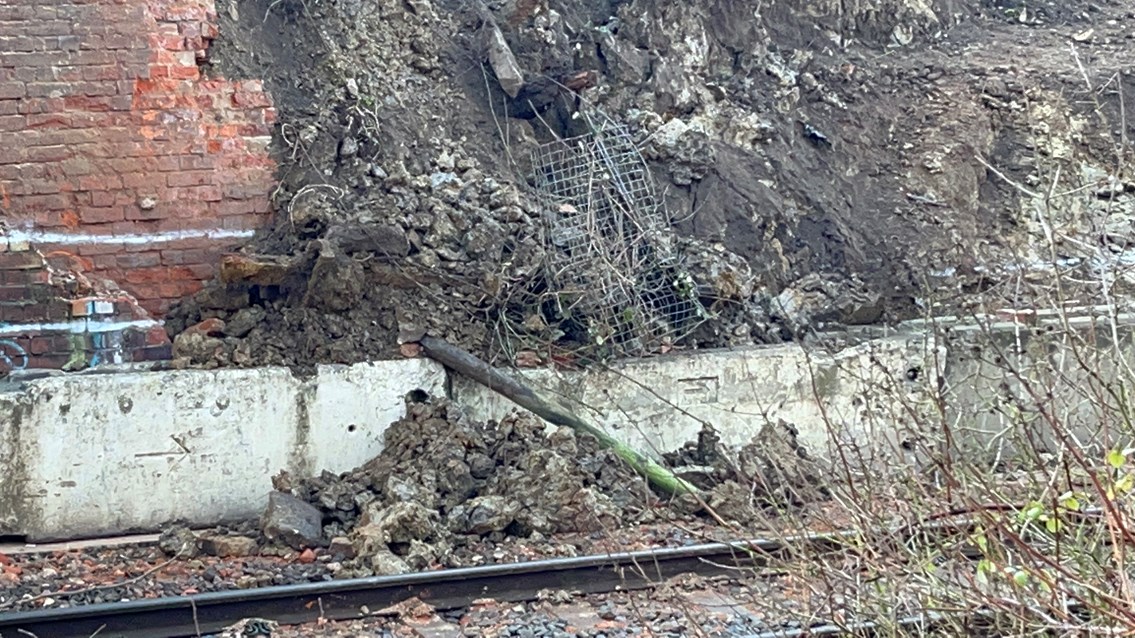 Evidence of the collapsed bridge side wing and surrounding embankment