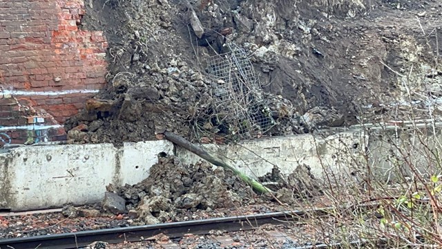 Evidence of the collapsed bridge side wing and surrounding embankment: Evidence of the collapsed bridge side wing and surrounding embankment
